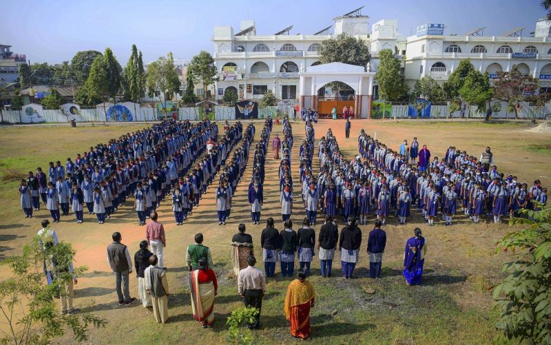 Agartala: Students attend morning prayers on the first day of school in Agartala, Monday, Jan. 4, 2021. Schools in Tripura reopened for students from class 5 to 8 today after remaining closed for months amid the COVID-19 pandemic. (PTI Photo)